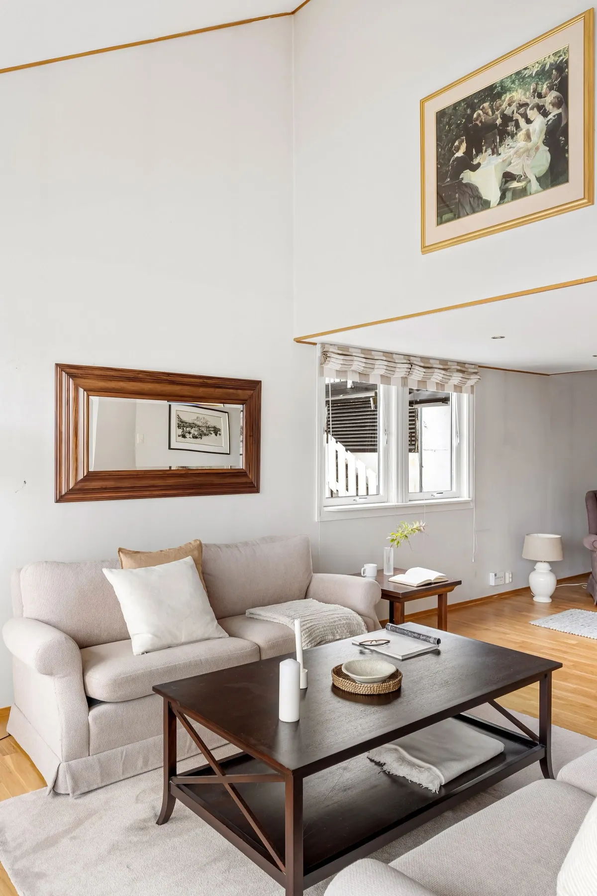 Illustrative stock photo: compact bright sitting room with a sofa and coffee table