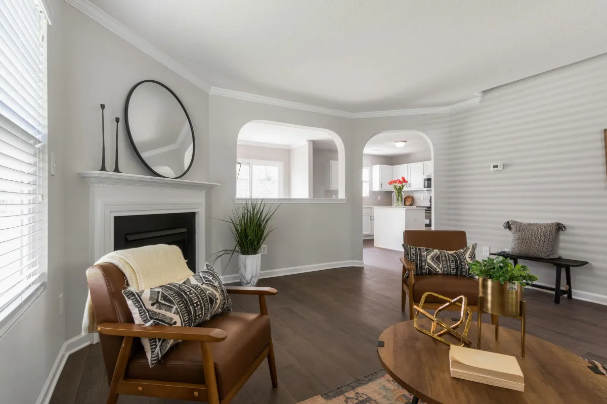 Illustrative stock photo: traditional living room with a fireplace and rounded doorway