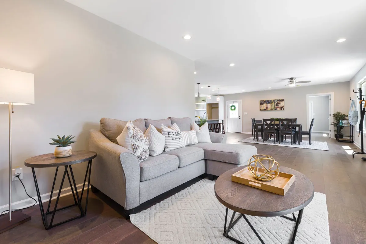 Illustrative stock photo: spacious modern living room opening into a dining area
