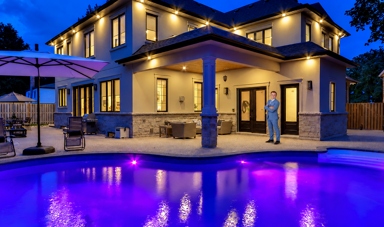Daniel Smallie standing beside a house and pool in a backyard patio composite